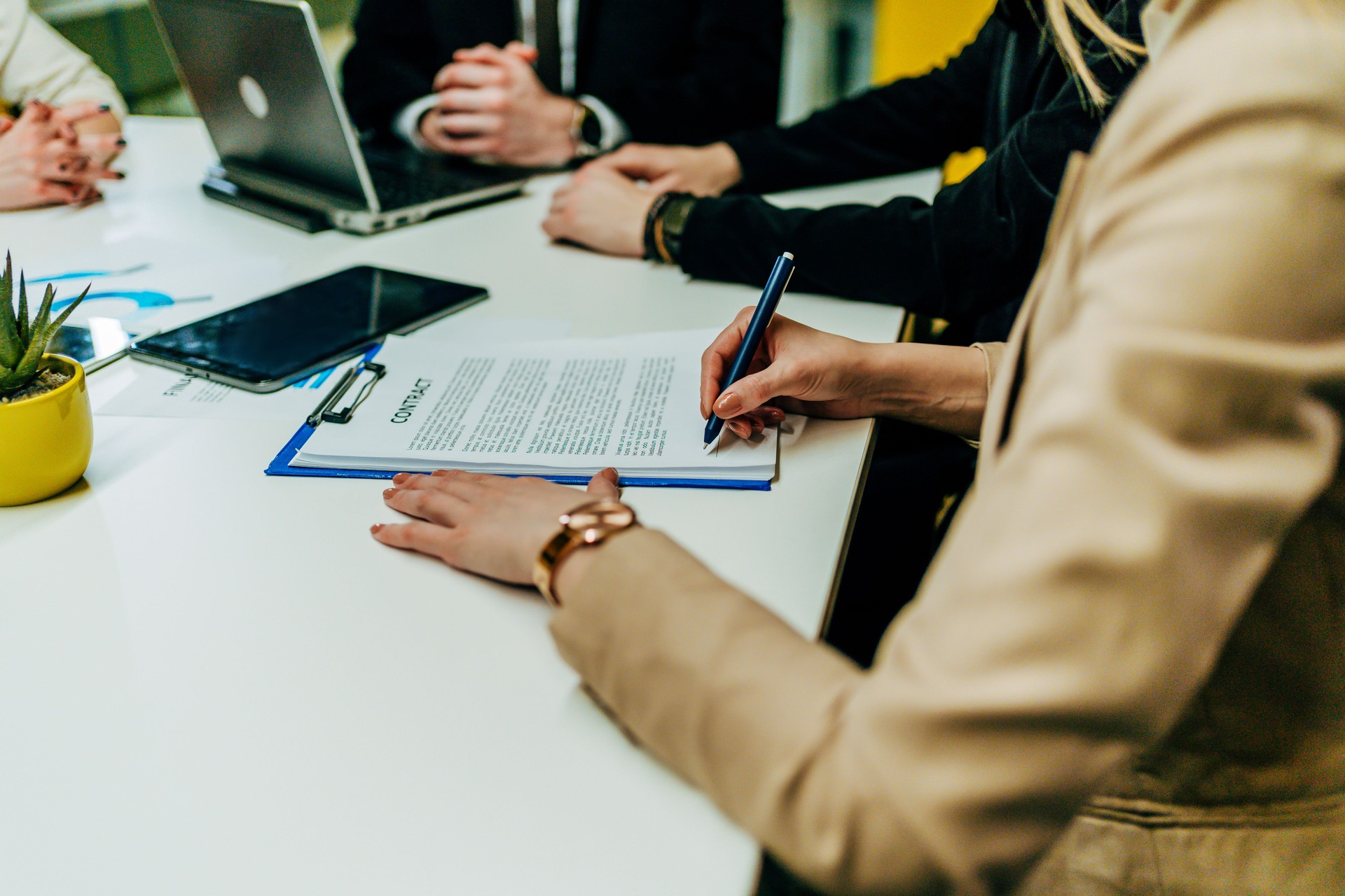 Business woman signing paper contract